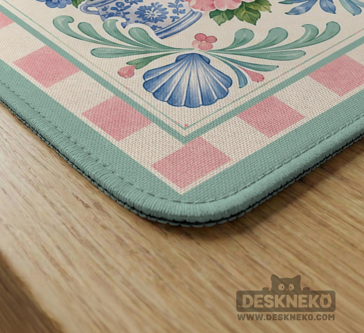 Pastel mahjong mat with a pink gingham border, seashells, hydrangea pots, palm trees, croquet details, and a coastal garden scene.
