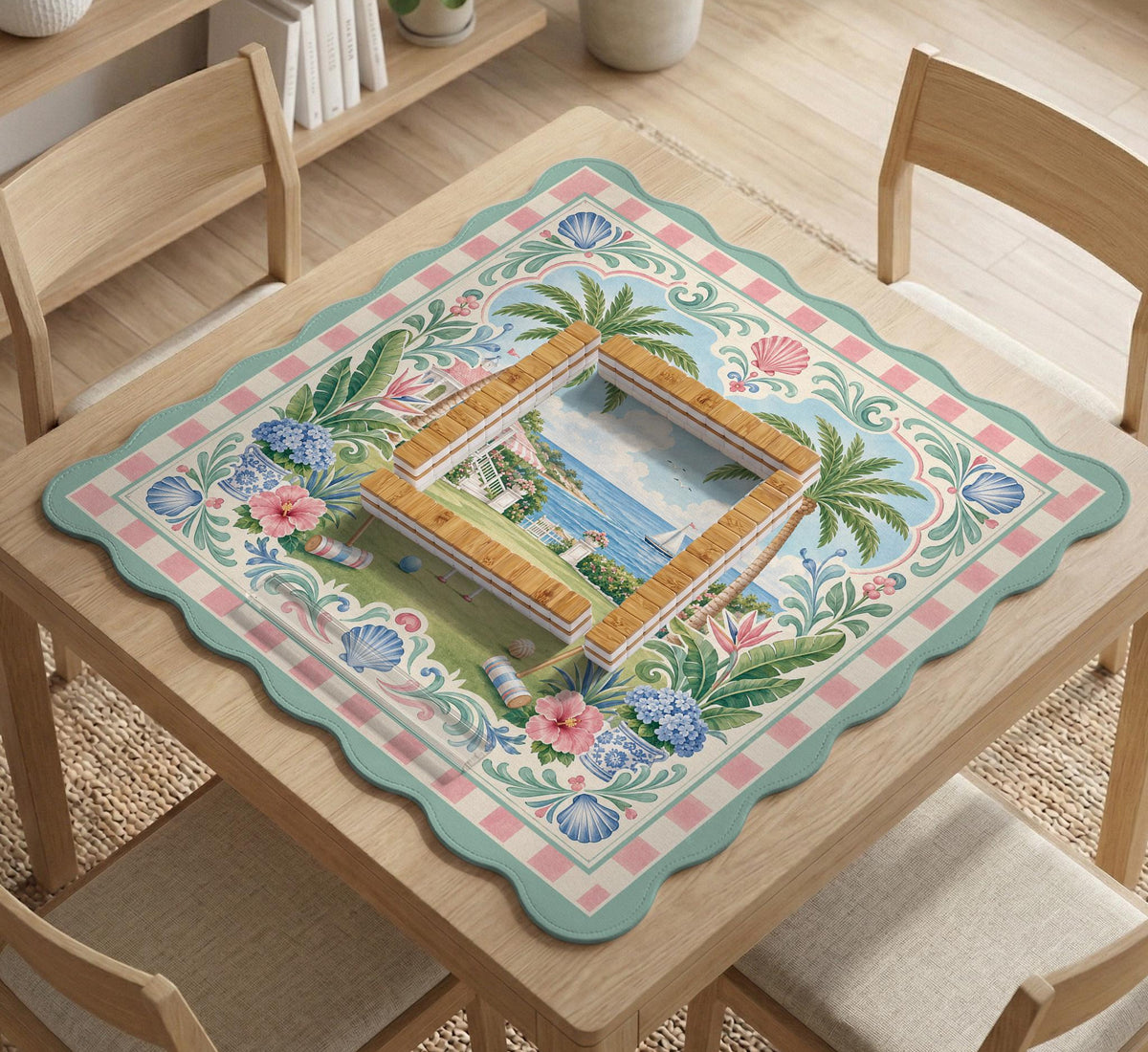 Pastel mahjong mat with a pink gingham border, seashells, hydrangea pots, palm trees, croquet details, and a coastal garden scene.
