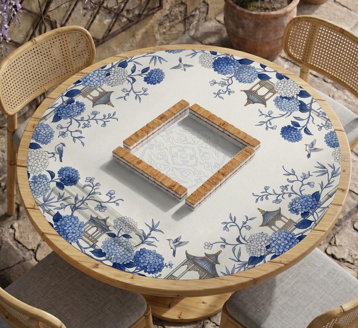 Blue and white square mahjong mat with a hydrangea and bird botanical border and a plain center area.