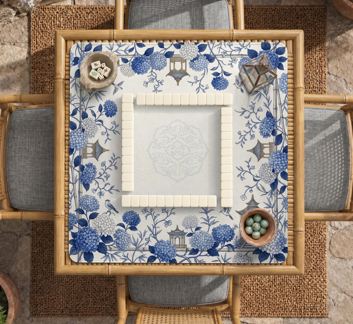 Blue and white square mahjong mat with a hydrangea and bird botanical border and a plain center area.