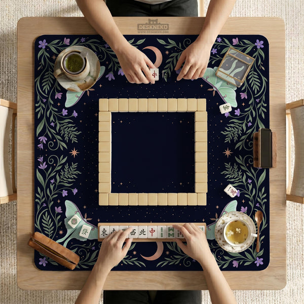 Navy square mahjong mat with a floral border, copper moons, scattered stars, pale moths, and leafy botanical details.