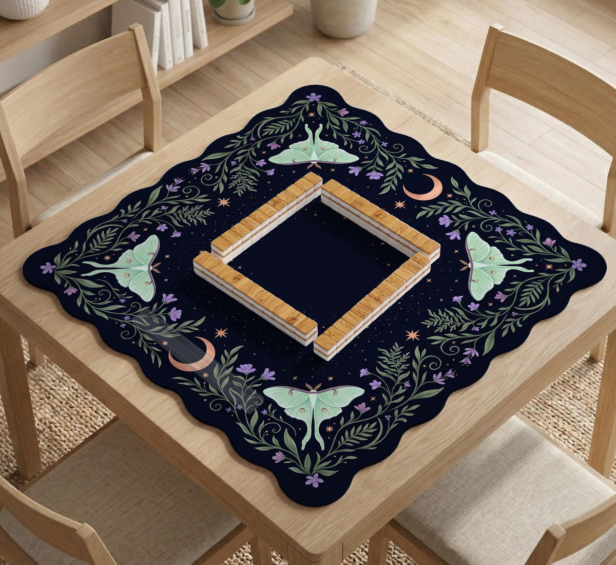 Navy square mahjong mat with a floral border, copper moons, scattered stars, pale moths, and leafy botanical details.