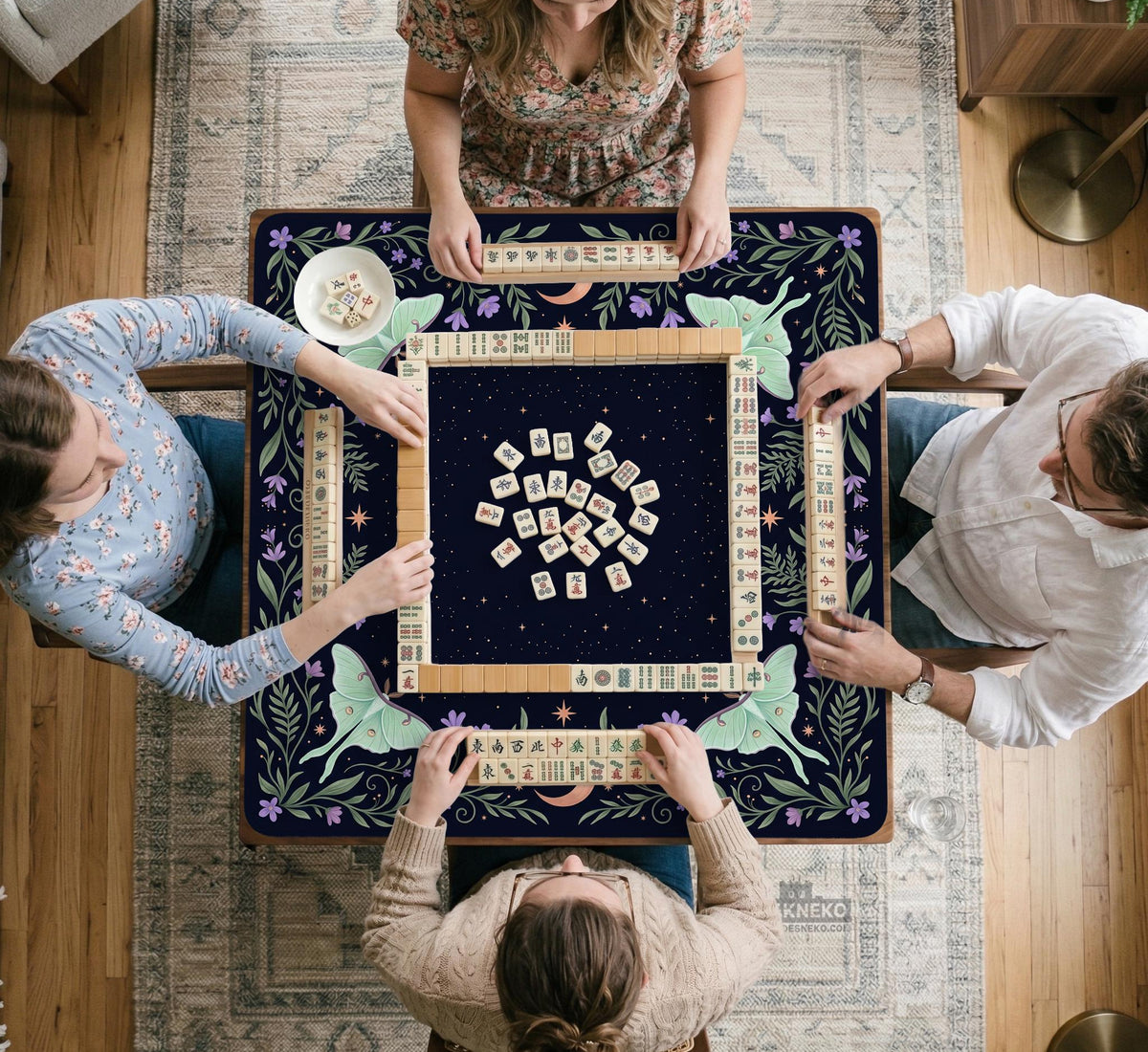 Navy square mahjong mat with a floral border, copper moons, scattered stars, pale moths, and leafy botanical details.