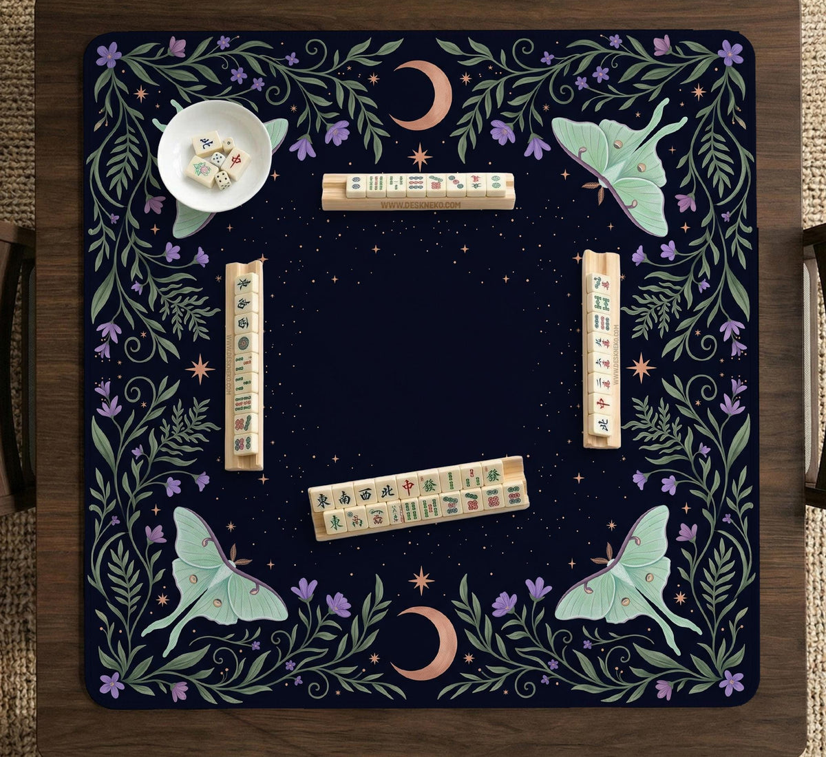 Navy square mahjong mat with a floral border, copper moons, scattered stars, pale moths, and leafy botanical details.