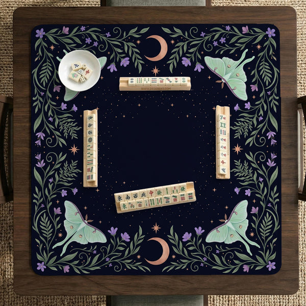 Navy square mahjong mat with a floral border, copper moons, scattered stars, pale moths, and leafy botanical details.