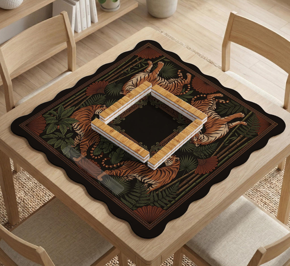 Black square mahjong mat with mirrored tiger faces, bamboo, dark tropical leaves, ornate border details, and orange accents.