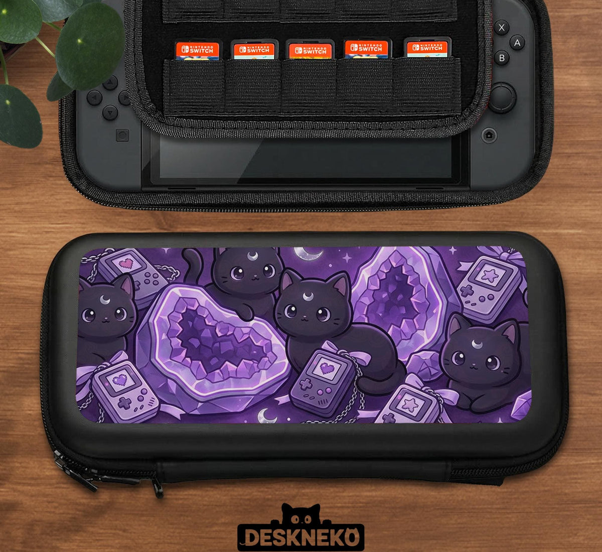Purple carrying case with black cat faces, moon shapes, stars, and crystal geode style artwork for Nintendo Switch.