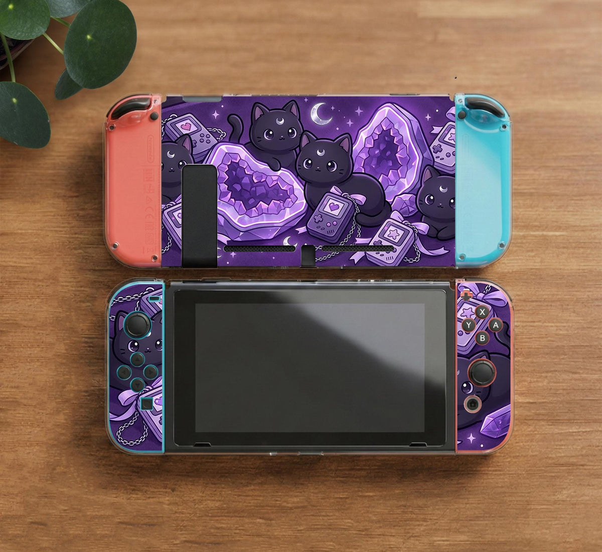 Purple carrying case with black cat faces, moon shapes, stars, and crystal geode style artwork for Nintendo Switch.