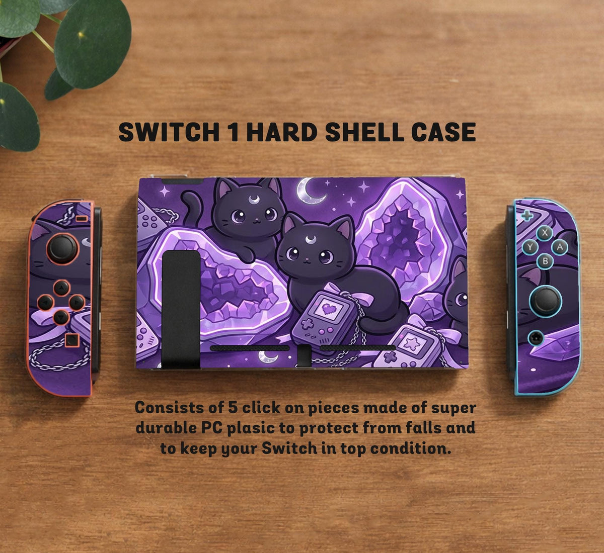 Purple carrying case with black cat faces, moon shapes, stars, and crystal geode style artwork for Nintendo Switch.