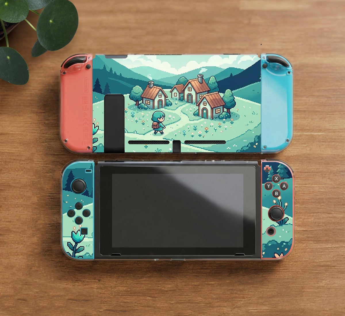 Teal carrying case with a pixel-style village scene, small houses, layered mountains, flowers, and a retro game-inspired landscape design.