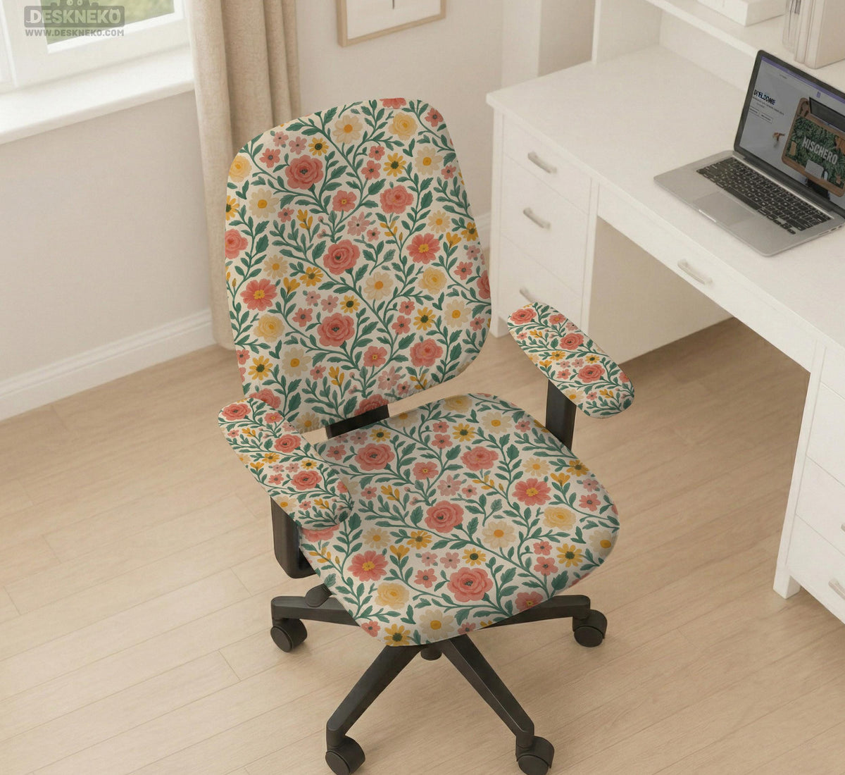 Cream desk chair cover with a vintage floral print featuring coral roses, mustard daisies, and green vines on a chair.
