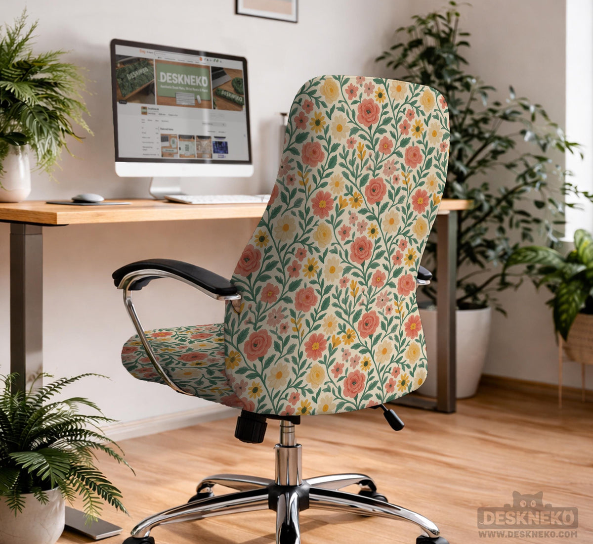 Cream desk chair cover with a vintage floral print featuring coral roses, mustard daisies, and green vines on a chair.