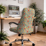Cream desk chair cover with a vintage floral print featuring coral roses, mustard daisies, and green vines on a chair.
