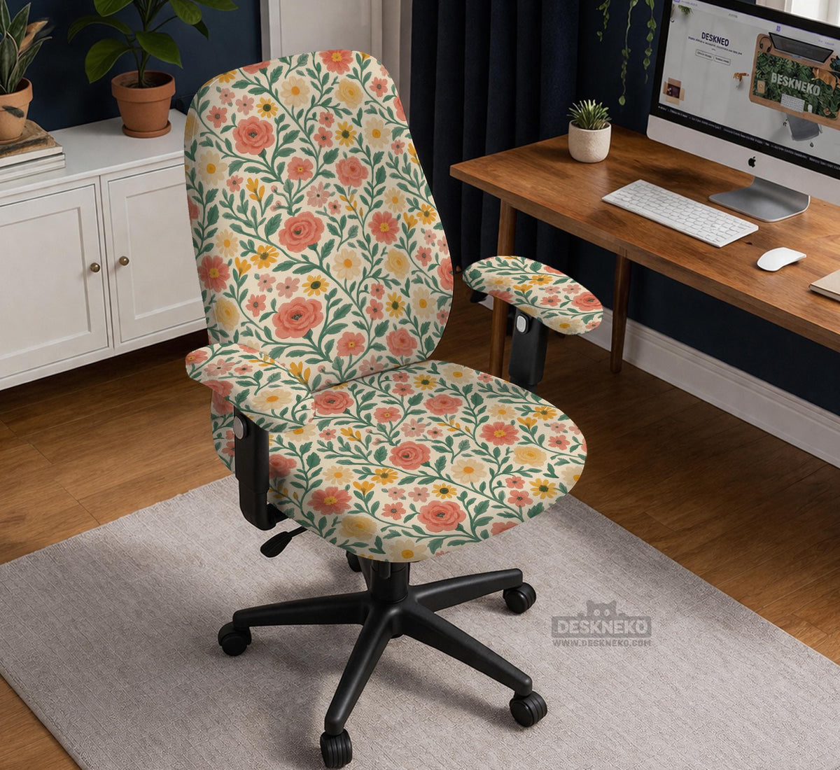 Cream desk chair cover with a vintage floral print featuring coral roses, mustard daisies, and green vines on a chair.