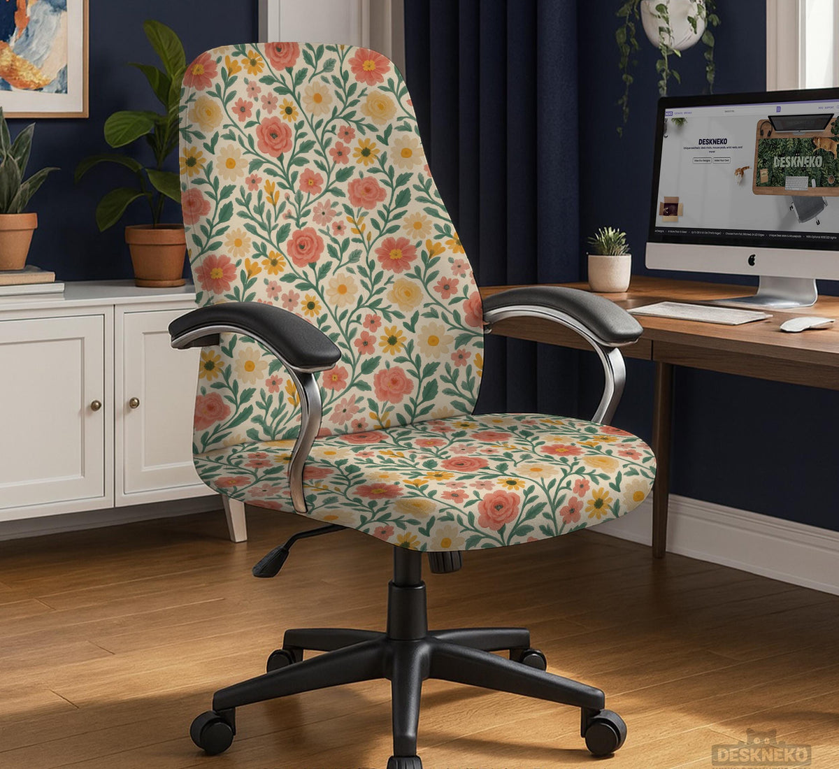 Cream desk chair cover with a vintage floral print featuring coral roses, mustard daisies, and green vines on a chair.