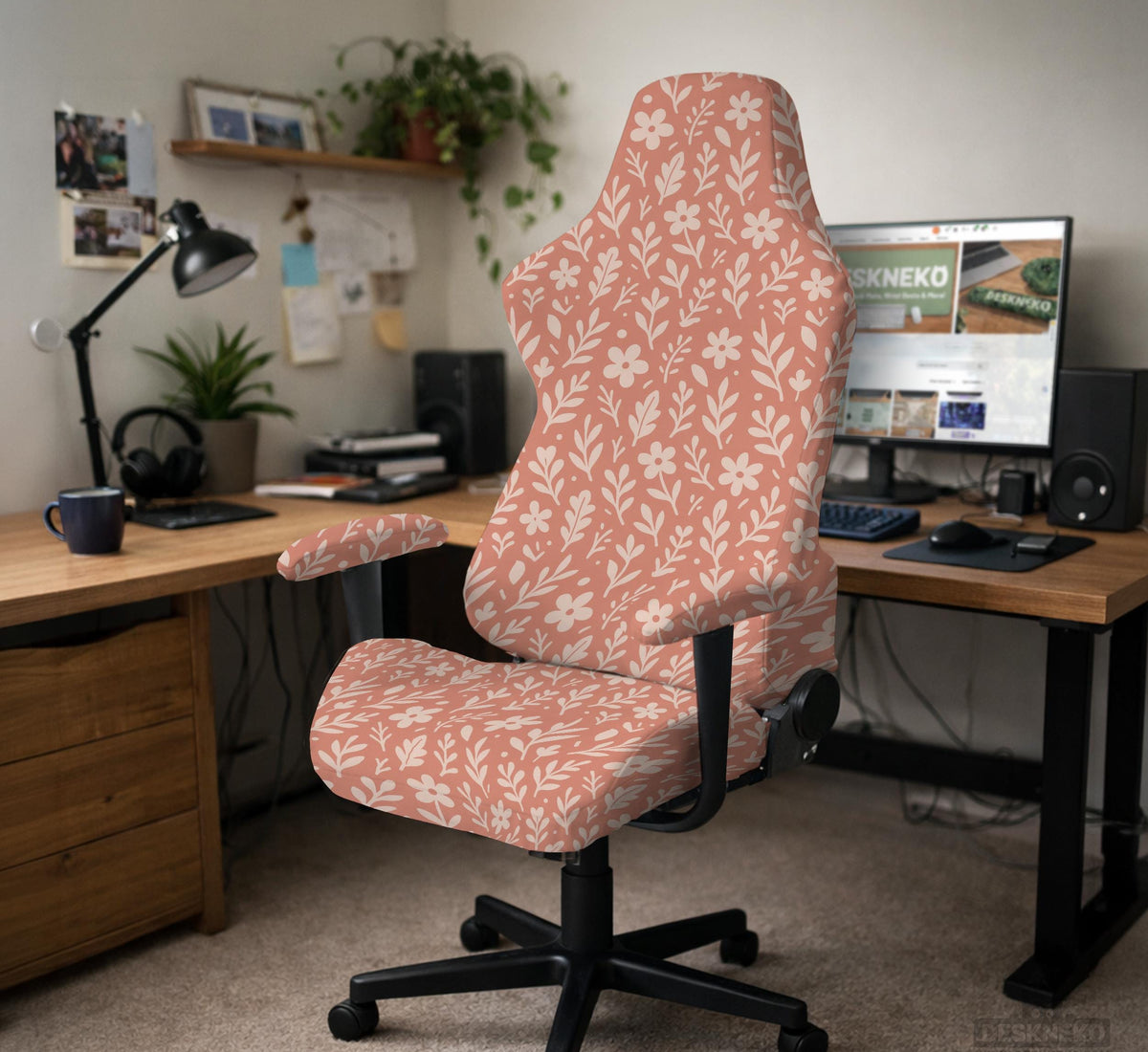 Pink chair cover with a botanical floral print shown on an office chair, with matching armrest covers and multiple cover style options.