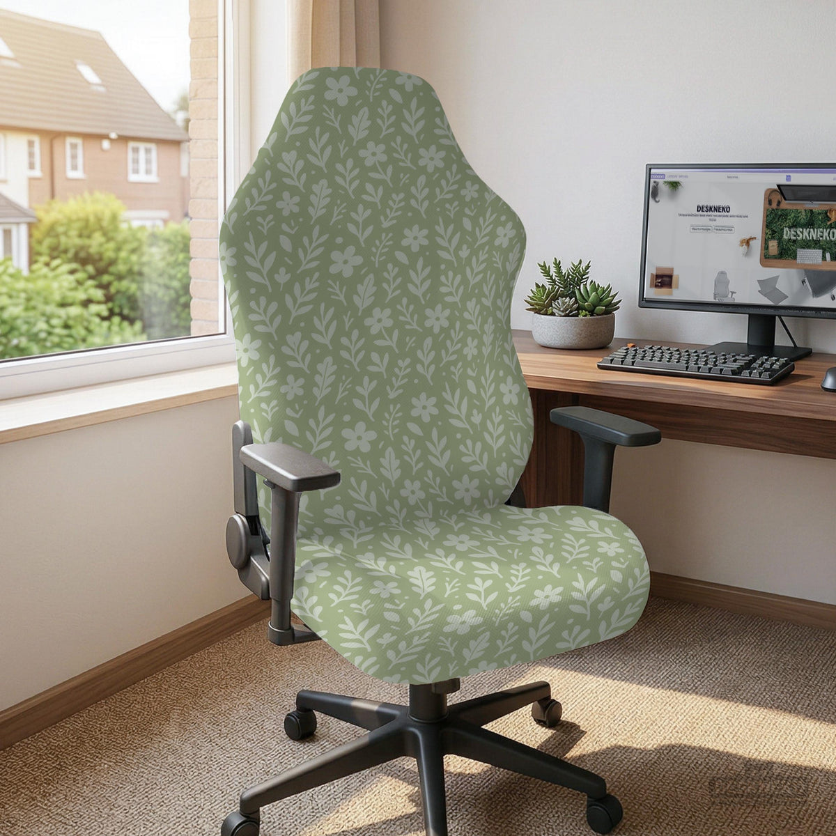 Sage green desk chair cover with a small floral and leaf print shown on an office chair.