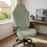 Sage green desk chair cover with a small floral and leaf print shown on an office chair.