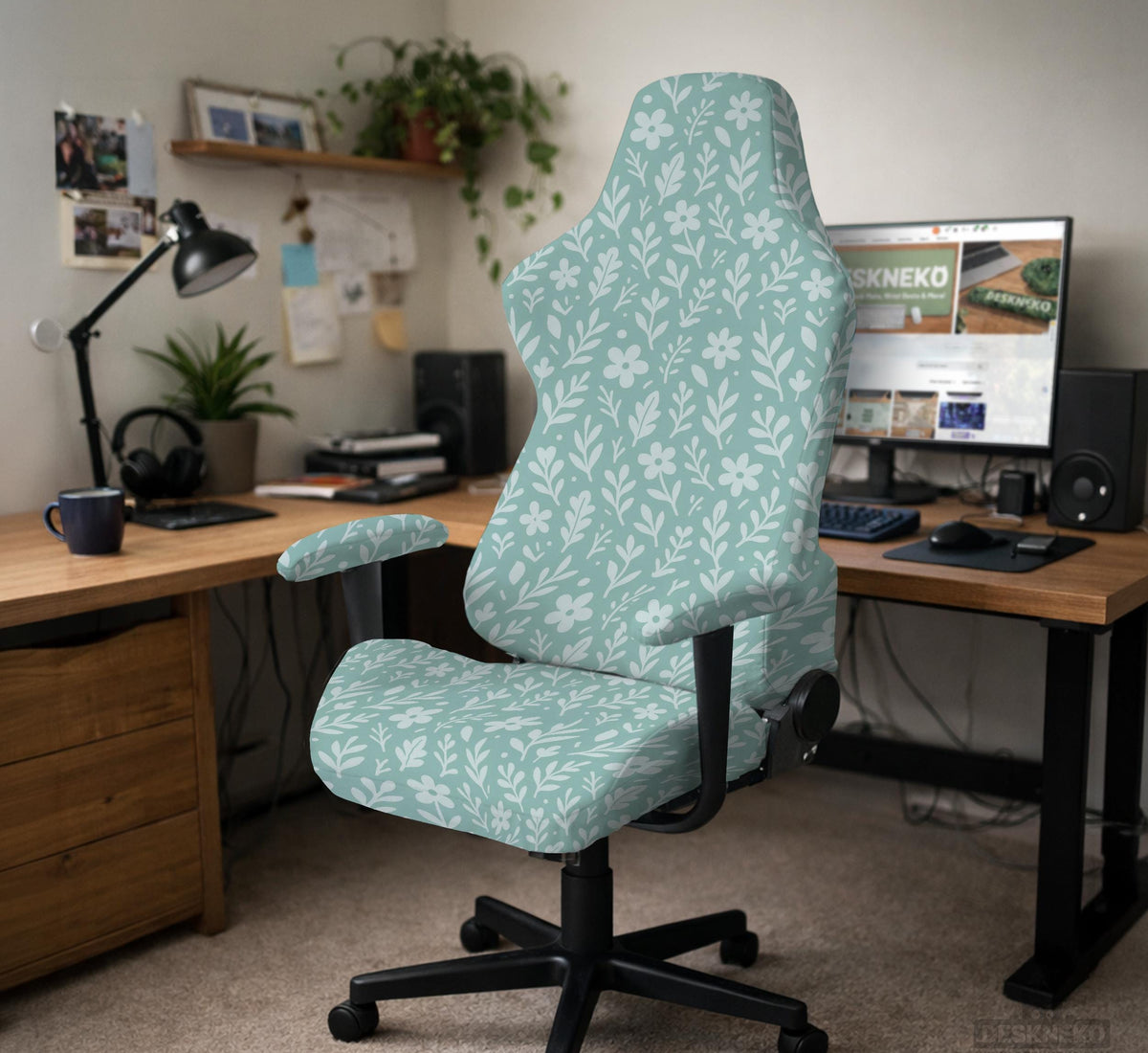 Mint and white botanical desk chair cover with a floral leaf pattern shown on an office chair.