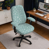 Sage and aqua green floral chair cover shown on a gaming chair with matching armrest covers.