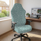 Sage and aqua green floral chair cover shown on a gaming chair with matching armrest covers.
