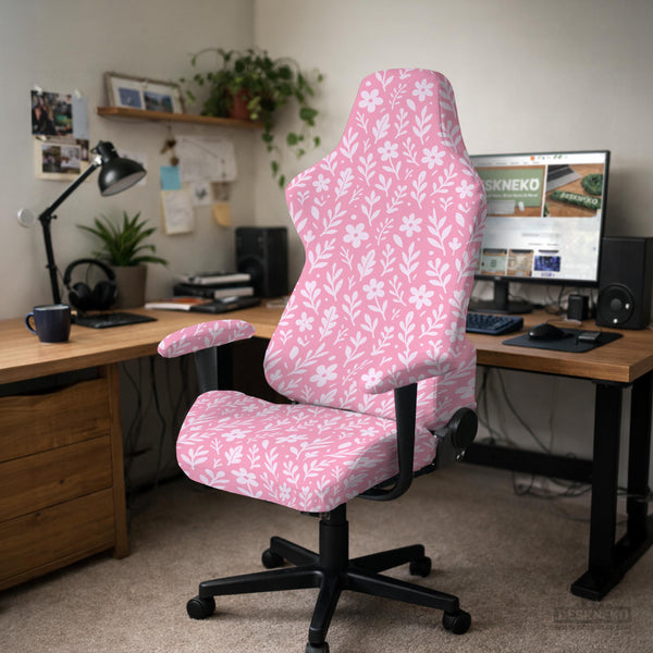 Soft pink floral chair cover shown on a gaming chair with a high back and armrests.