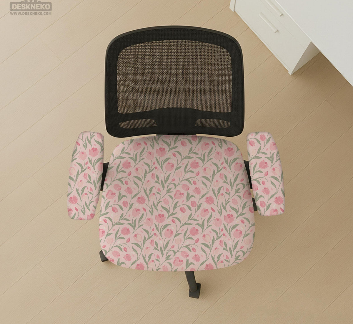 Pink chair cover with a tulip floral print shown as a desk chair slipcover, with armrest covers and size options.