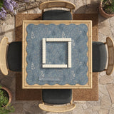 Blue mahjong mat with a botanical floral pattern, pale leaves, and delicate stems on a dusty blue background.
