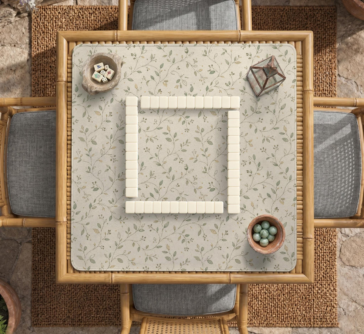 Cream square mahjong mat with a sage vine and leaf botanical pattern and scalloped edges.