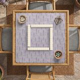 Lavender mahjong mat with a pale purple background, small botanical sprigs, and fine grid lines.