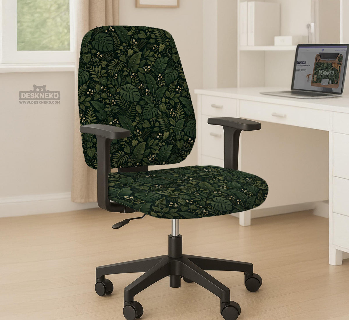 Forest green chair cover with a tropical leaf pattern featuring monstera leaves and small cream flowers.