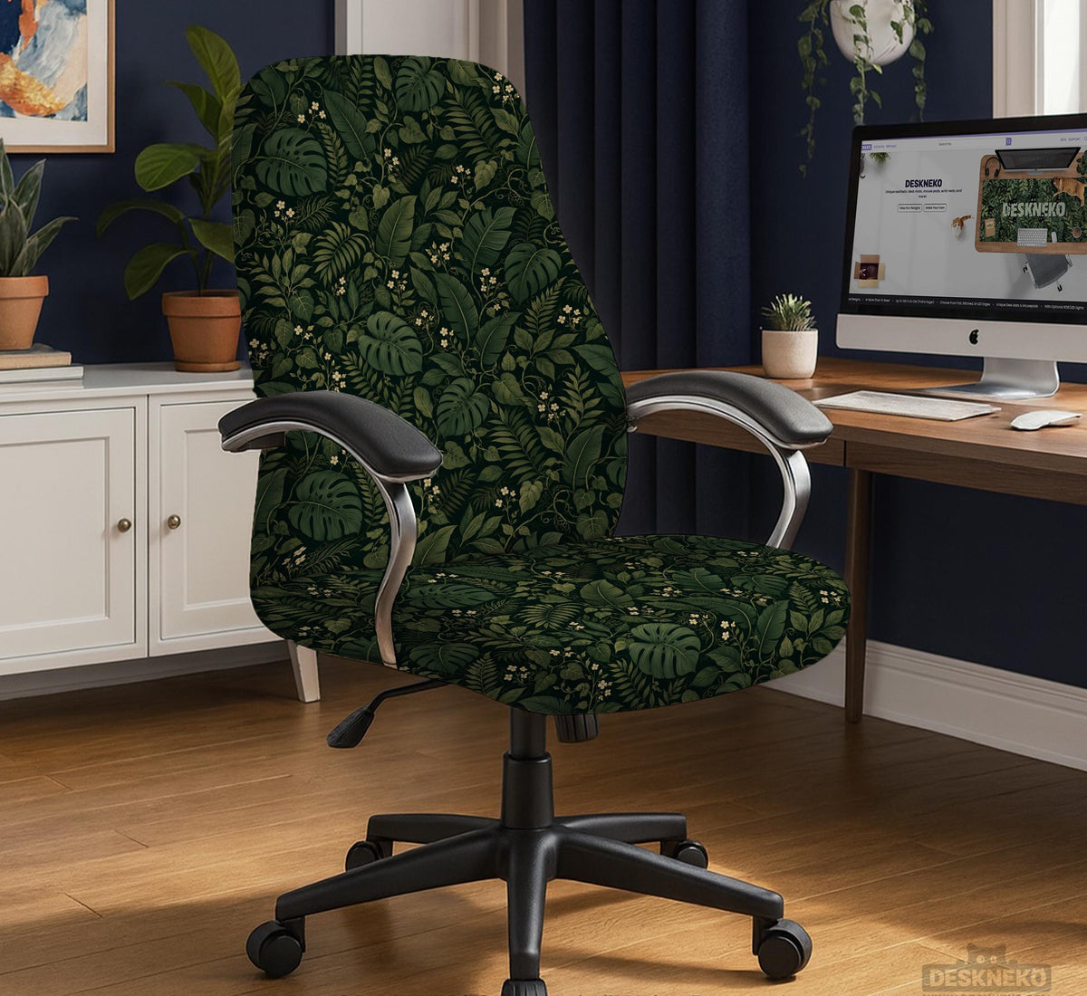 Forest green chair cover with a tropical leaf pattern featuring monstera leaves and small cream flowers.