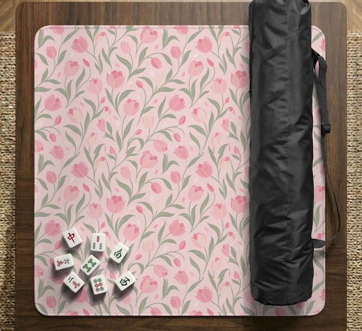 A pink mahjong mat with tulip flowers, sage leaves, and a light pastel background.