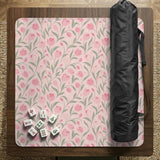 A pink mahjong mat with tulip flowers, sage leaves, and a light pastel background.
