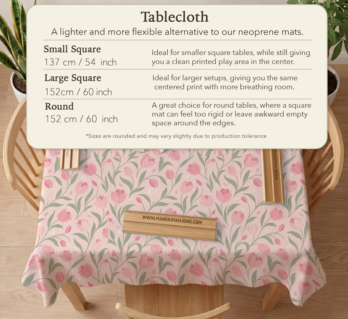 A pink mahjong mat with tulip flowers, sage leaves, and a light pastel background.