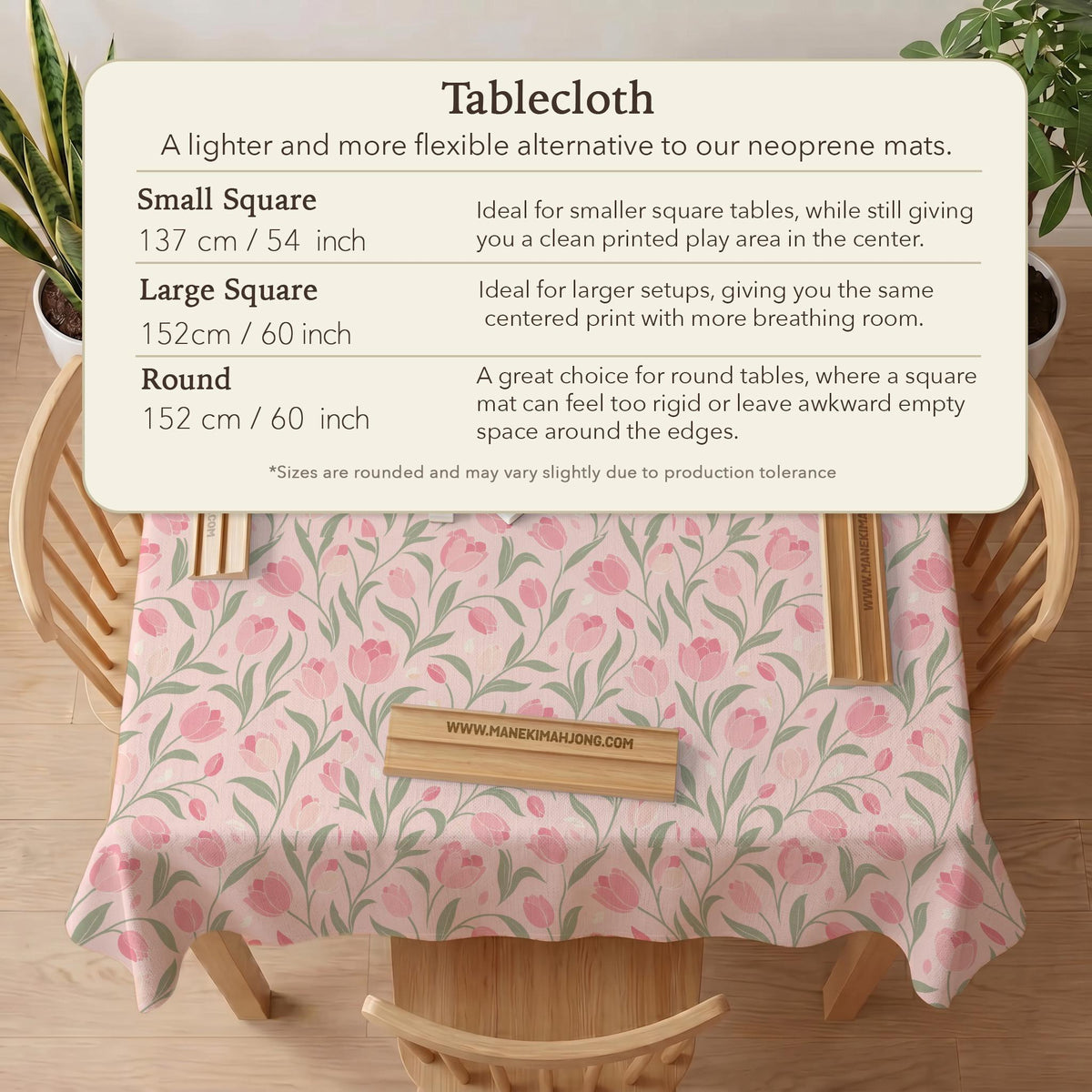A pink mahjong mat with tulip flowers, sage leaves, and a light pastel background.