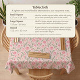 A pink mahjong mat with tulip flowers, sage leaves, and a light pastel background.
