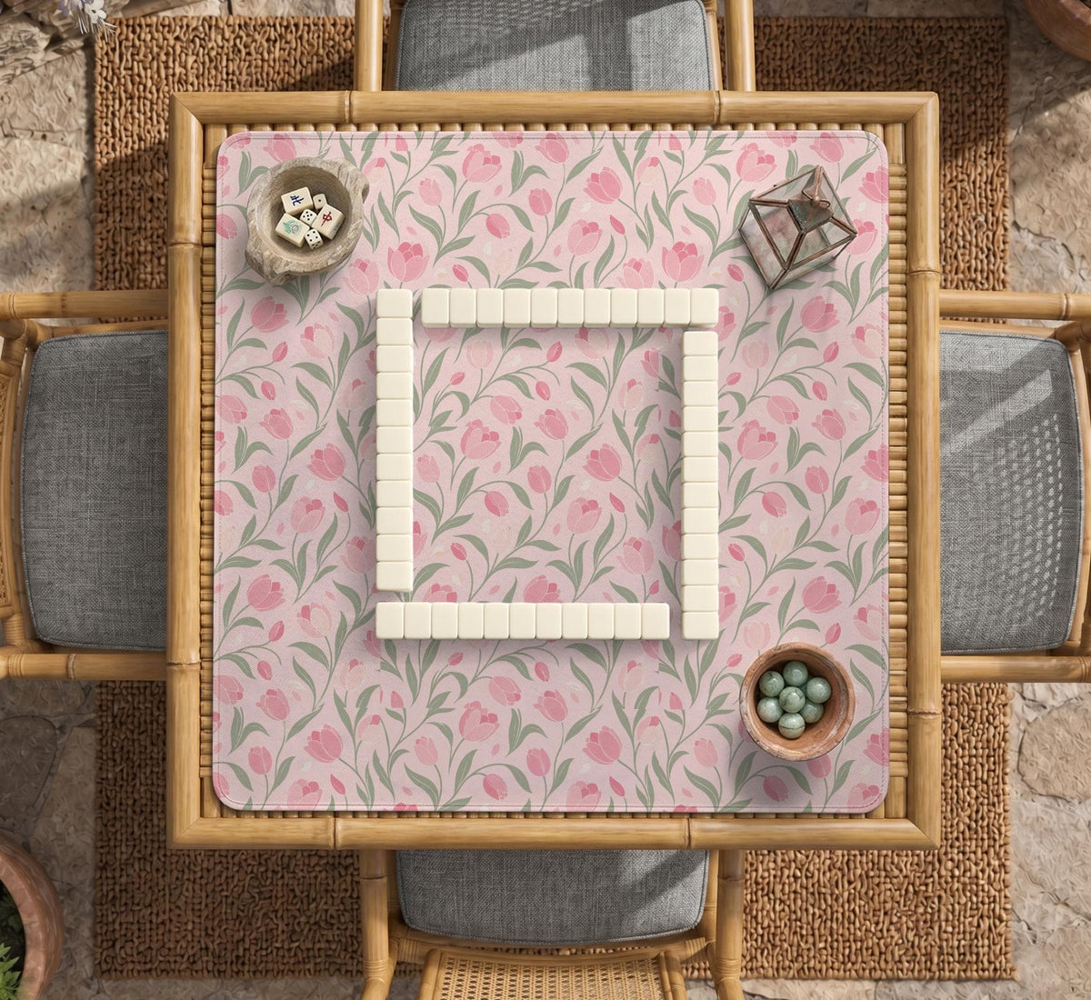 Pink mahjong mat with a tulip floral pattern in blush and sage tones and a scalloped edge.