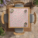 A pink mahjong mat with tulip flowers, sage leaves, and a light pastel background.