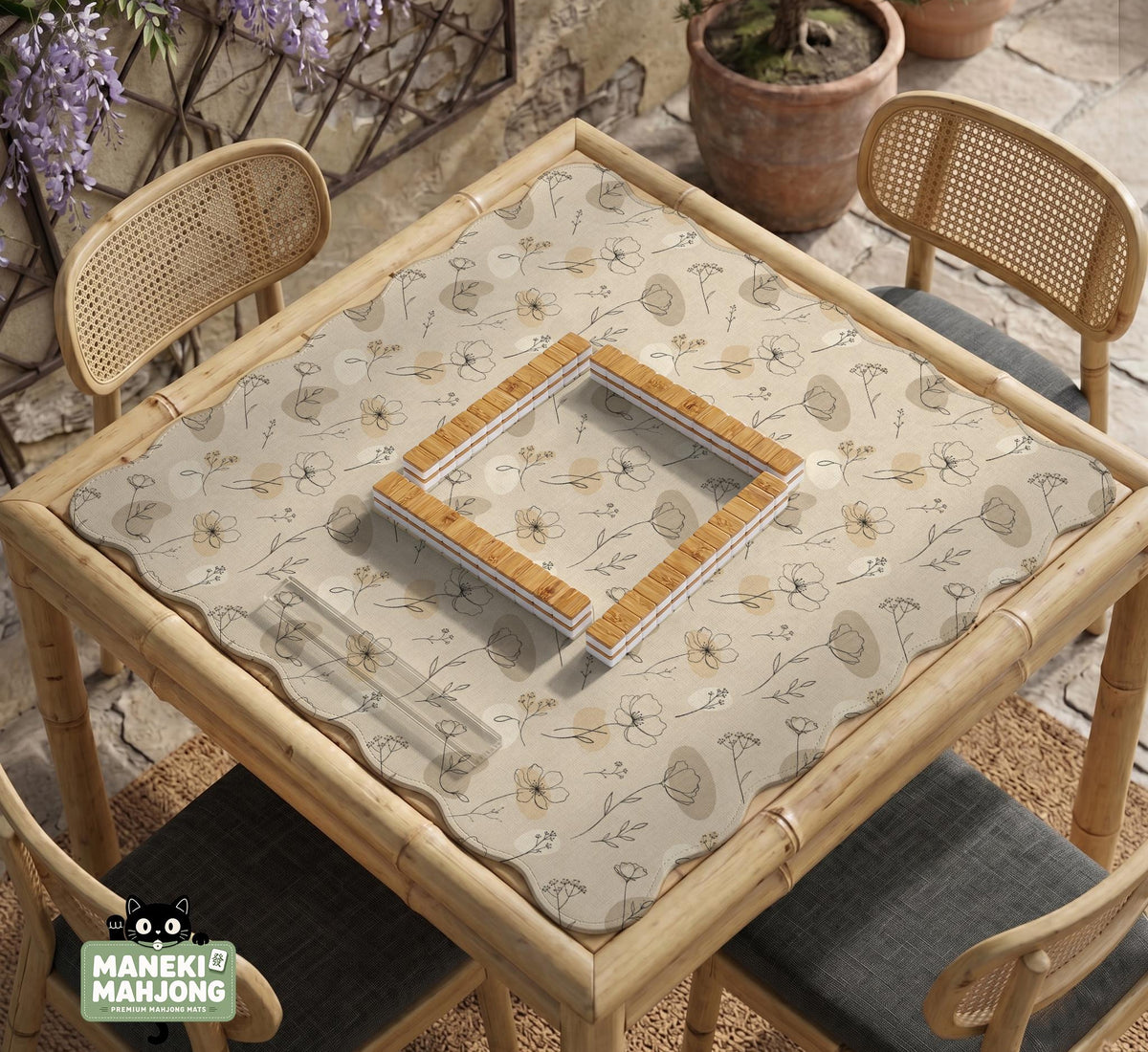 Neutral floral mahjong mat with delicate botanical line art and a scalloped edge on a cream background.