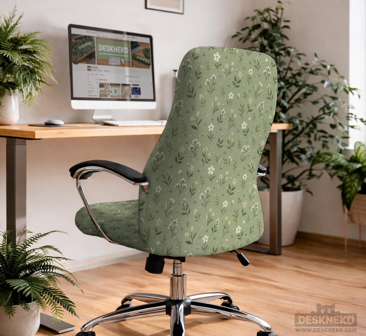 Sage green chair cover with a small floral print shown on a desk chair with a high back.