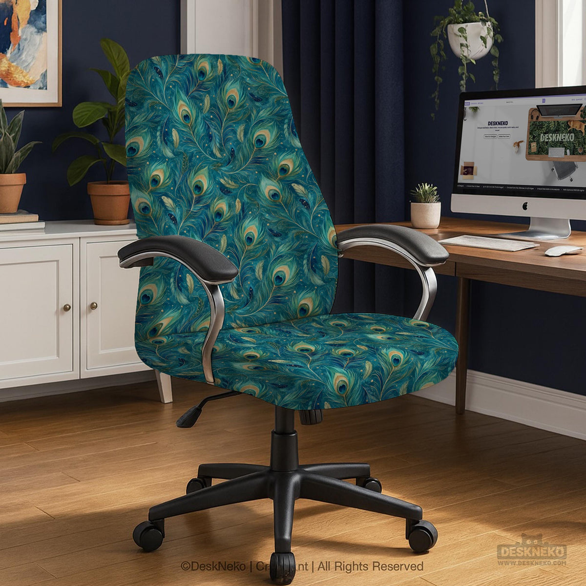 A blue green chair cover with a peacock feather design shown on an office chair with armrests.