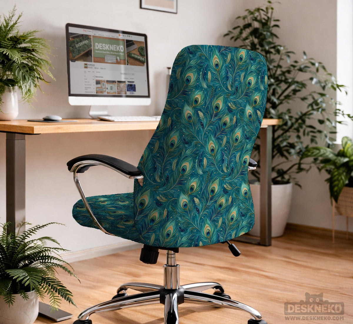 A blue green chair cover with a peacock feather design shown on an office chair with armrests.