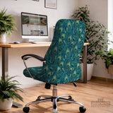 A blue green chair cover with a peacock feather design shown on an office chair with armrests.