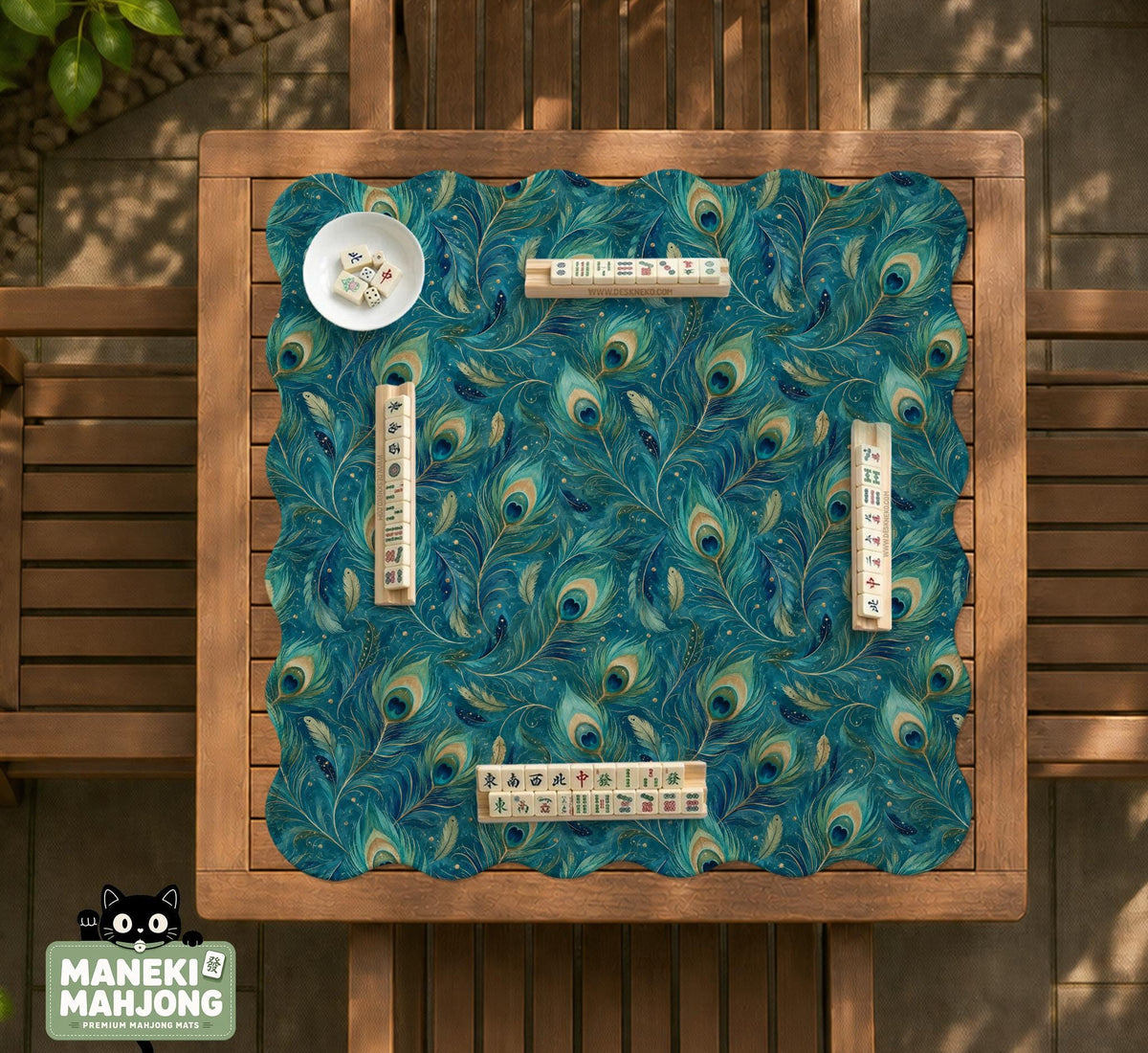 Teal mahjong mat with a peacock feather pattern in blue green tones.