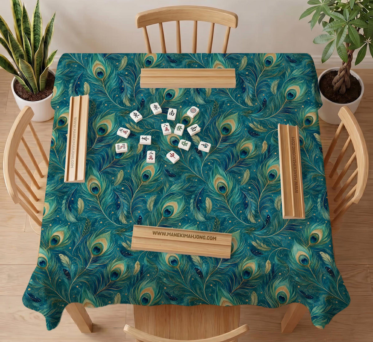 A teal mahjong mat with a peacock feather pattern and scalloped edges.