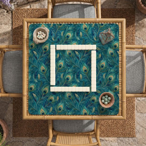 Teal mahjong mat with a peacock feather pattern in blue green tones.