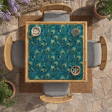 A teal mahjong mat with a peacock feather pattern and scalloped edges.
