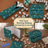 A teal mahjong mat with a peacock feather pattern and scalloped edges.