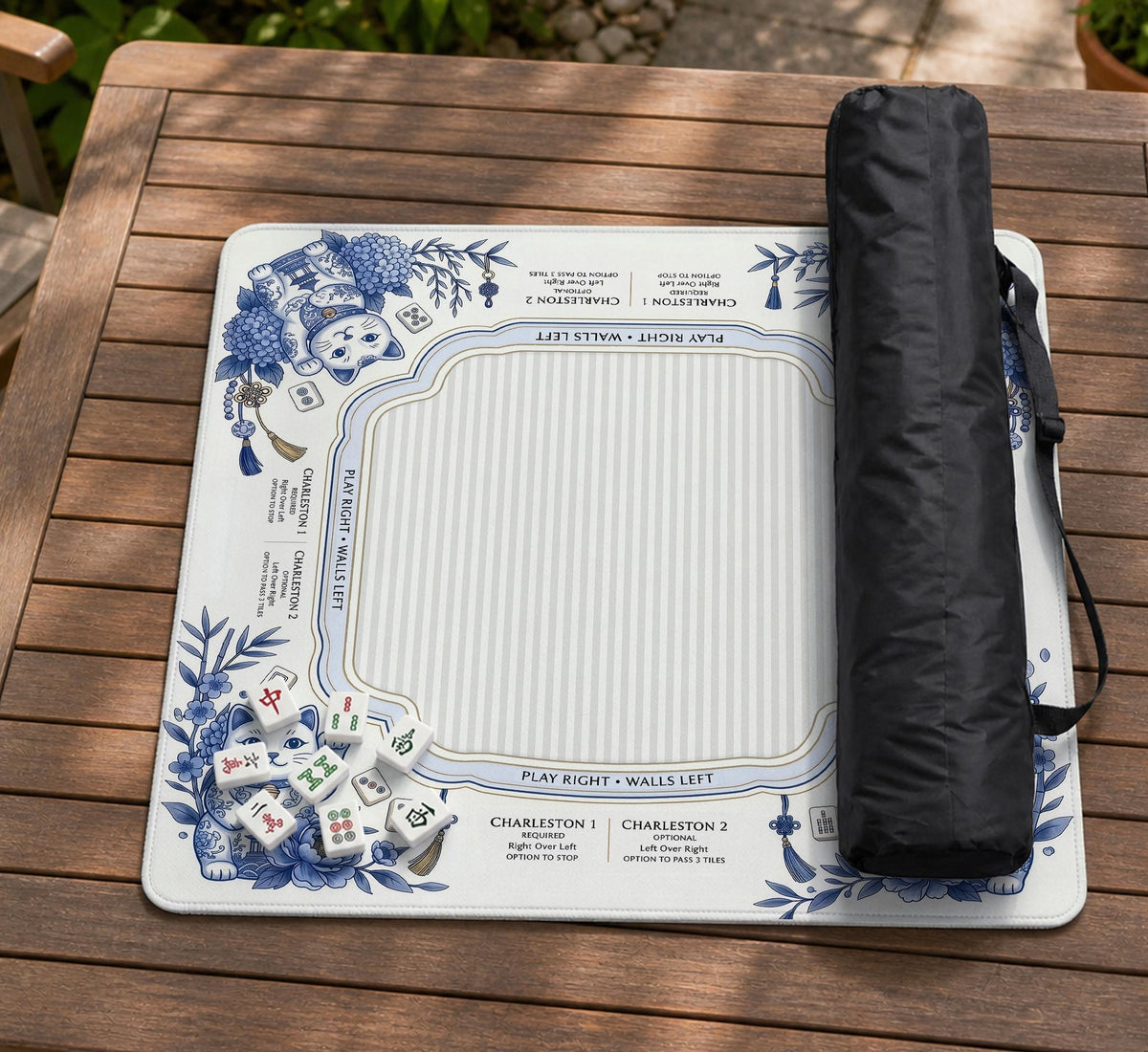 Blue and white square mahjong mat with lucky cat artwork, floral chinoiserie pattern, tile icons, and a rule guide layout.